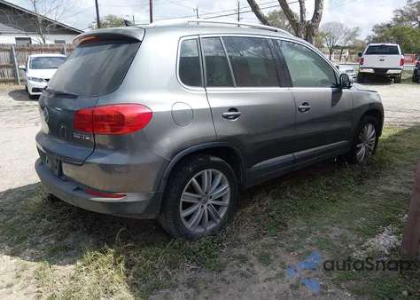 2014 Volkswagen Tiguan Sel z USA, uszkodzony, nr VIN WVGAV3AXXEW059222